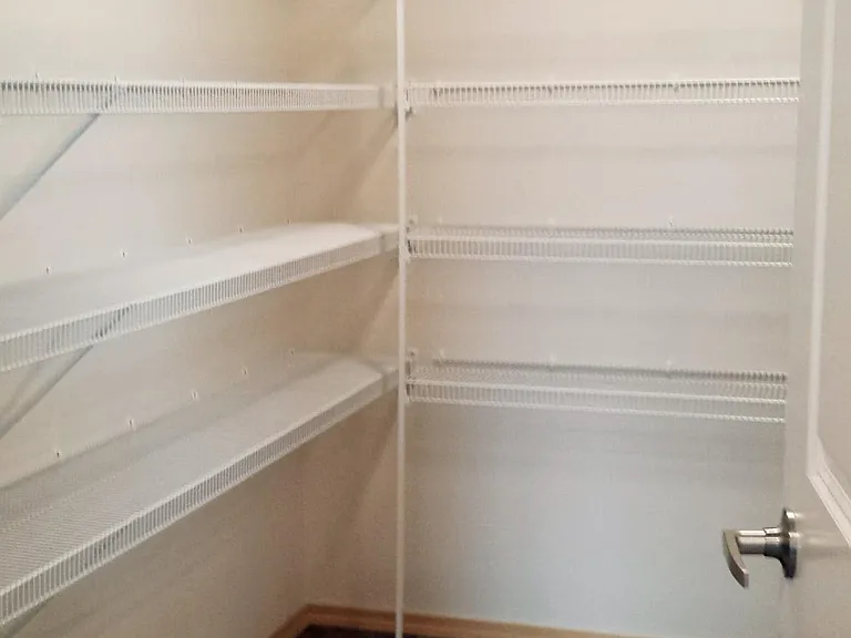Huge walk -in pantry offers plenty of storage.