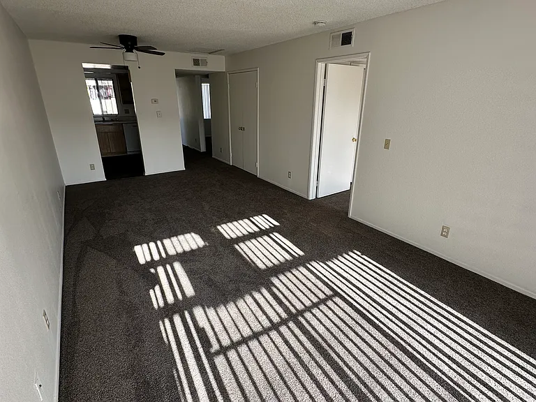 Entrance of the two bedroom two baths. Dining room and living room, hallway closet, center air and kitchen.