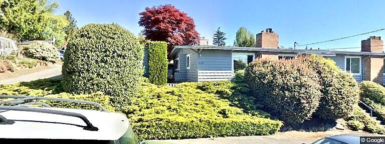 This unit has its own entrance and is surrounded by mature landscape on a quiet street. One parking space is right outside the entrance . There is also a garage.