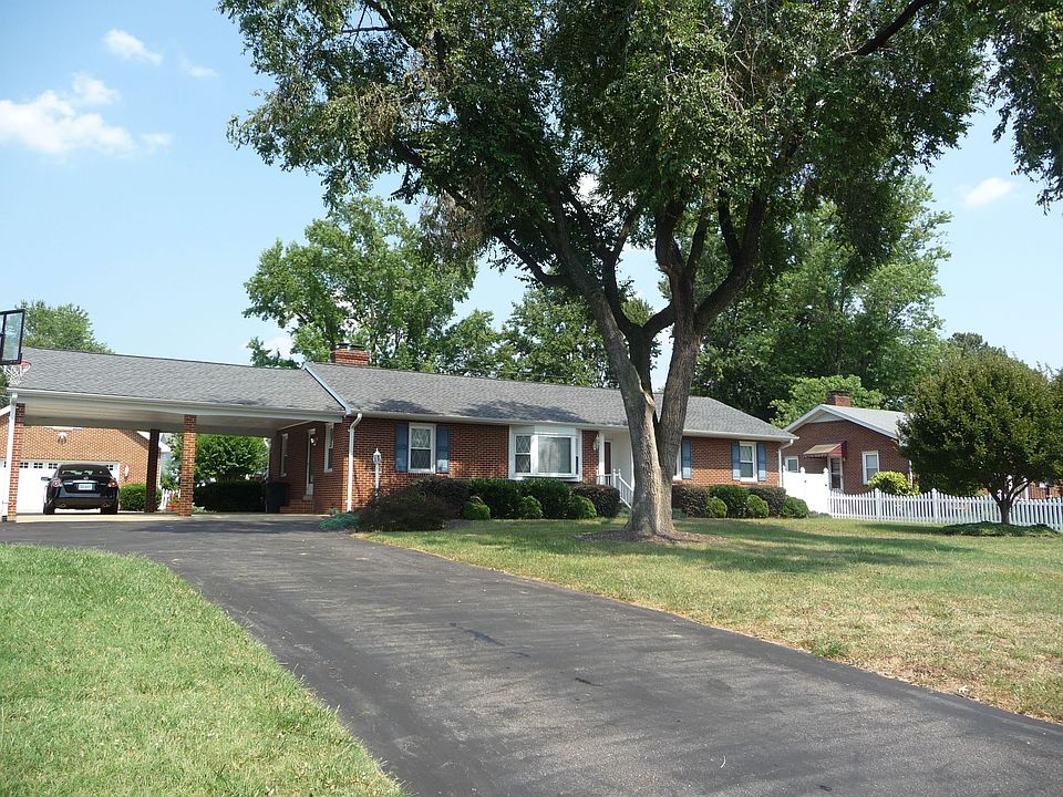 ALL BRICK rancher w/paved drive way and 2 car attached carport