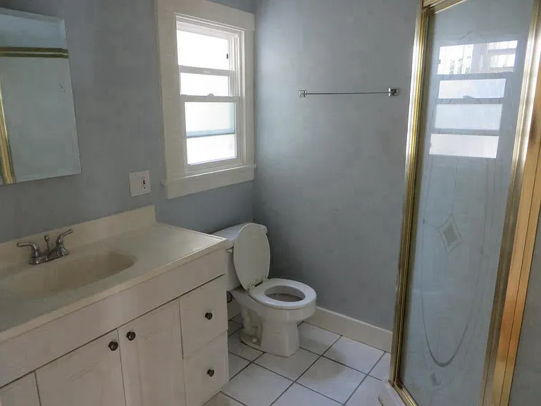 Spacious bathroom with upright stall shower