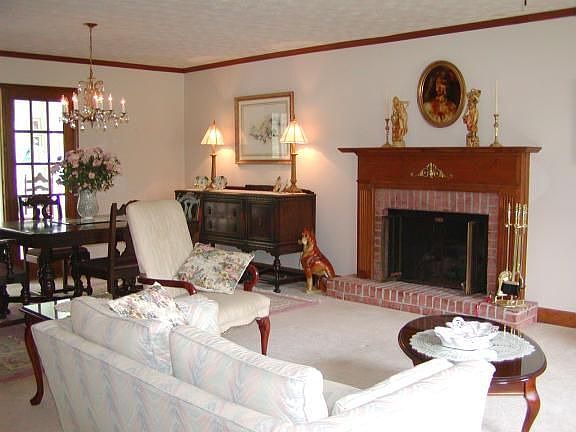 Great Room showing gas log fireplace and French doors to sunroom.