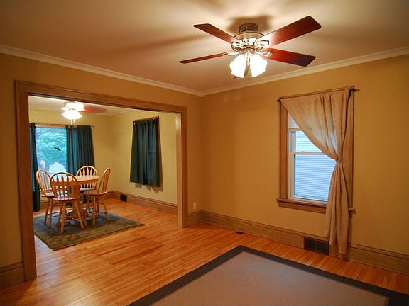 Recently finished hardwood floors and natural woodwork abound.