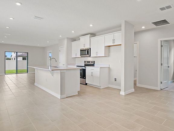 The Atlantic offers a bright open layout with a modern kitchen, island, and connected living space-i
