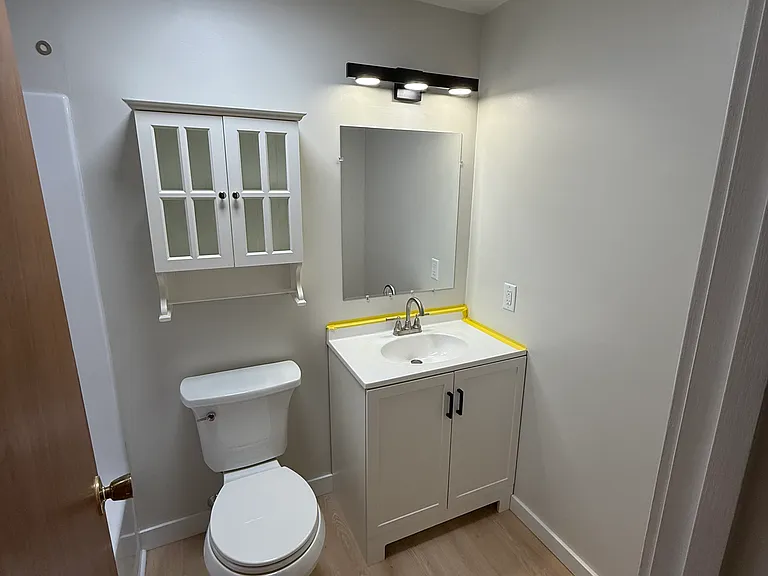 NEW bathroom vanity, NEW whisper-quiet lighted exhaust fan, NEW dimmable LED vanity light, NEW toilet and NEW hot water heater