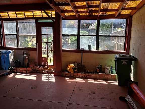 partially covered patio and large fenced yard, low maintenance back yard