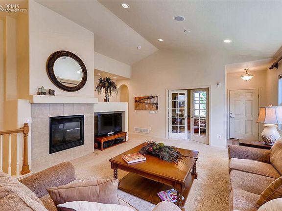 Spacious living room with french doors leading to main level office