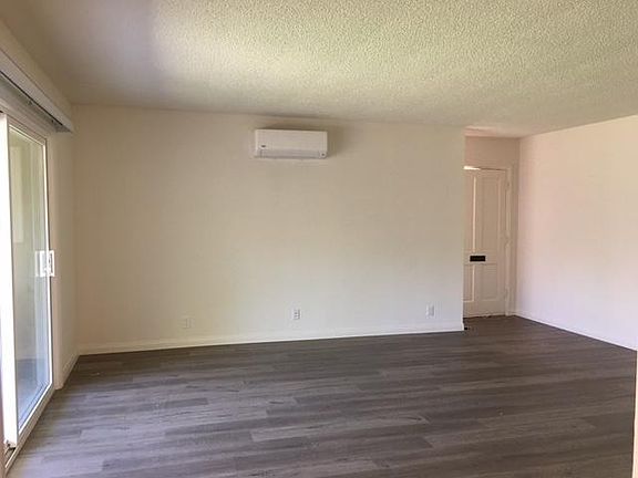 Upgraded with durable laminate flooring throughout.