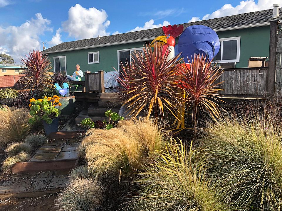 Front of the house on Santa Lucia with steps leading to a large deck.