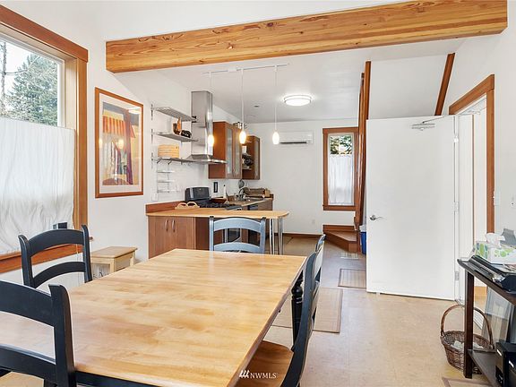 Open concept kitchen with access to a private porch. >