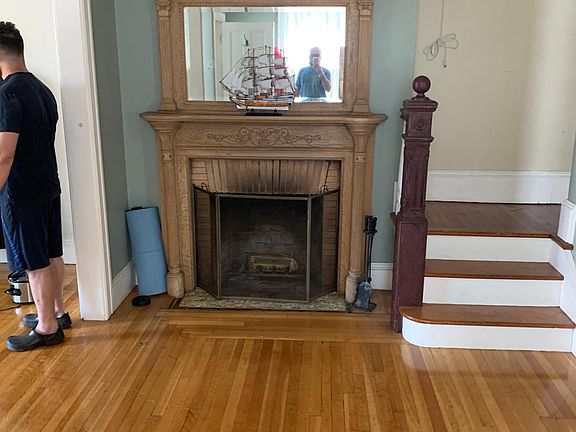 entry parlor with working firelplace, pocket door to left to close off dining room