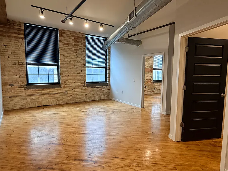 (Photos of similar unit with same floor plan. Unit 211 will have higher exposed beam ceilings. Colors, finishes, and fixtures may vary)