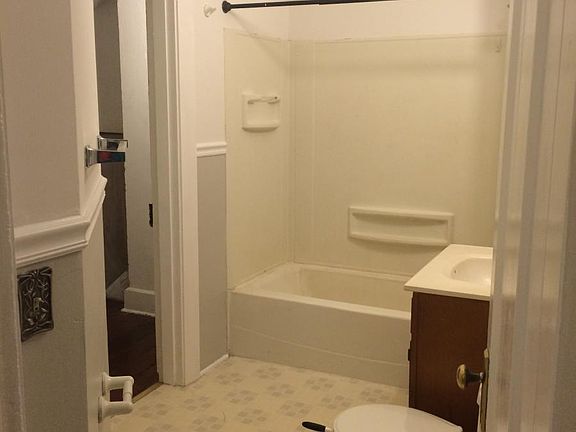 Bathroom with attached walk-in closet