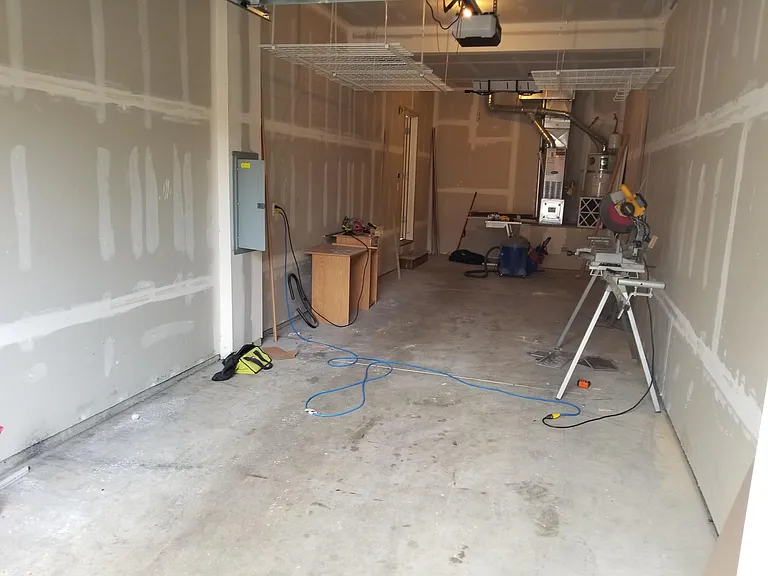 2 car tandem garage, with 3 ceiling storage holders.