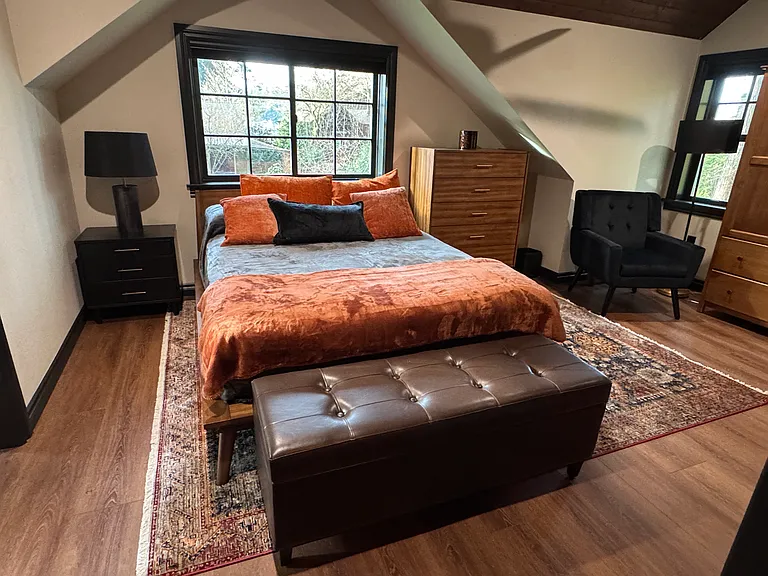 Loft bedroom featuring a comfortable, private sleeping retreat overlooking the living space below.