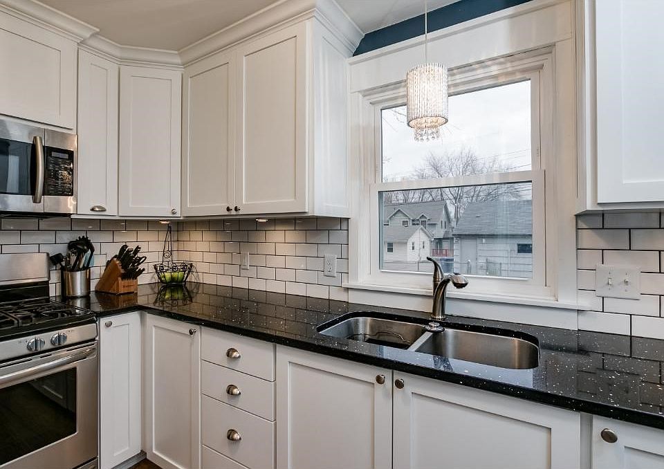 Quartz Countertops, Custom Cabinets with soft close drawers, spice racks, and new high end appliances.