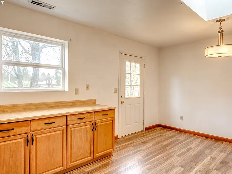 Kitchen/ Dinning room; door to deck