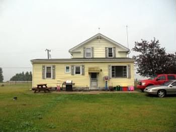 A view of the backside or lakeside of this home. There is a nice size cement patio right off this ba