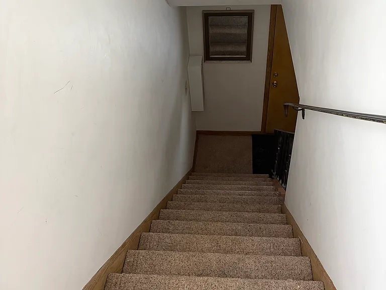 Stairwell leading to upstairs unit