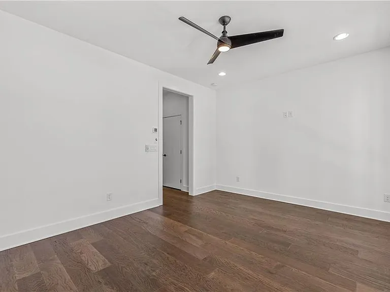Main Bedroom (Note: Actual unit has light wooden floors and upgraded fixtures / appliances)