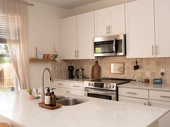 Kitchen opening to living/family room