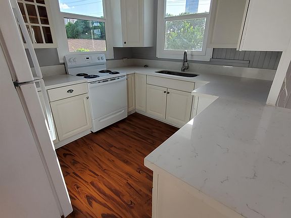 Newly remodeled Kitchen with new range, countertops, and sink.