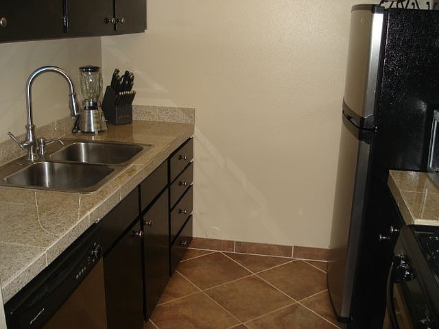 Kitchen w/granite Counters and Stainless appliances