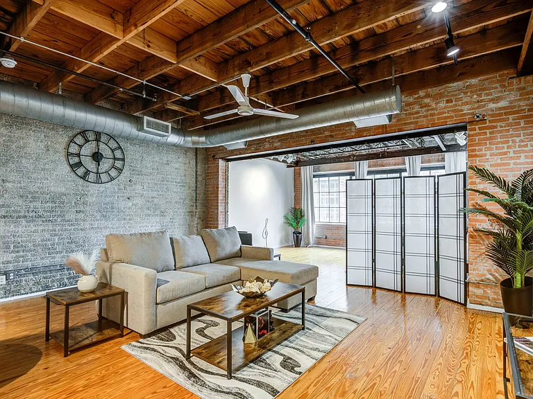 Renovated Lofts with exposed steel beams and brick accents