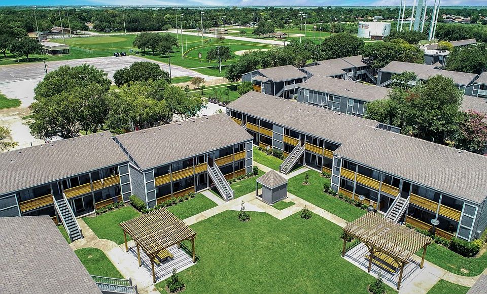 Texas City apartments with spacious community layout and landscaped grounds