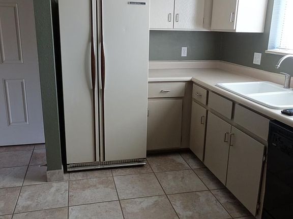 Large kitchen with new tile floors