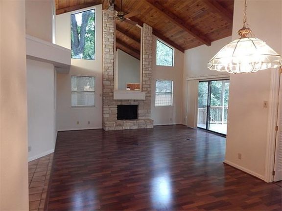 From dining looking into great room. Mirror above fireplace.