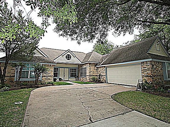 MATURE TREES AND LUSH LANDSCAPING WELCOME YOU HOME