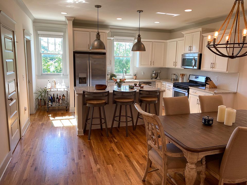 Bright and new home features much natural light, beautiful light fixtures and hardwood floors.