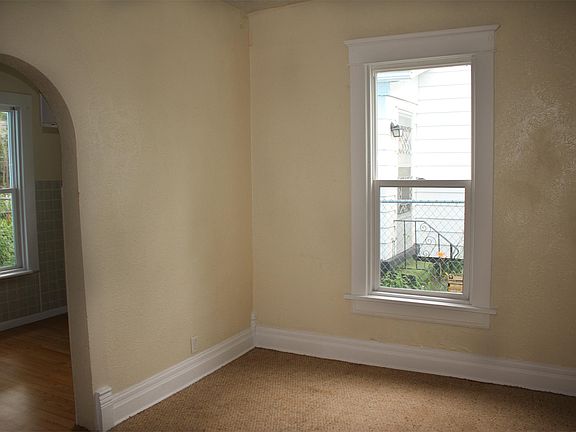 Main living area right inside the front door. Carpeted.