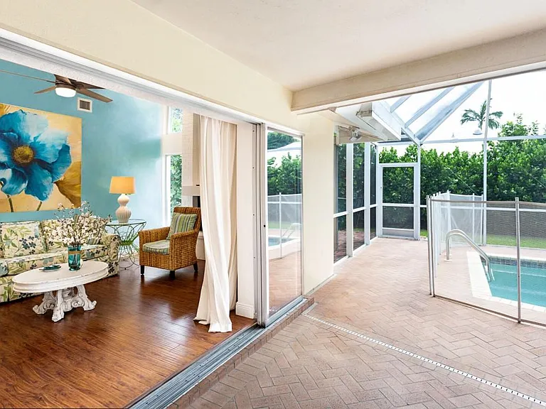Patio and pool with view of family room