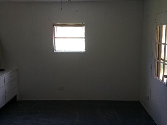 Bedroom #1 with built-in dresser and private entrance.