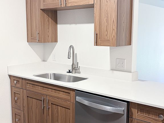 Freshly renovated kitchens featuring sleek countertops, upgraded fixtures, and abundant cabinet storage.