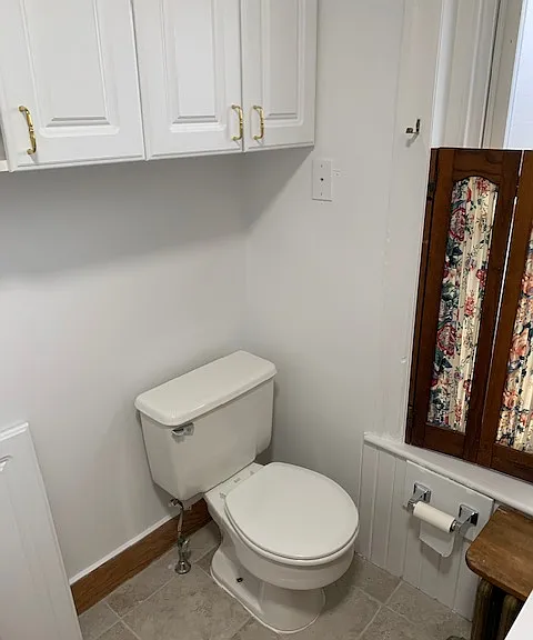 Bathroom 1. Shutters can be taken down or replaced.