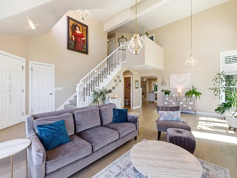 Bright and inviting living room featuring large windows and abundant natural light.