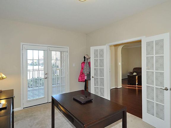 French door entry into this spacious office area.  Easy access to one of the covered front porch
