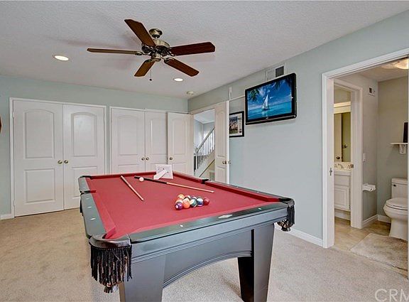 Downstairs master currently used as game rooms offers a sliding glass door taking you to the back ya