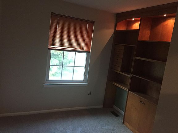 Smallest bedroom. Built-in cherry shelving. Large closet. Overlooks green space