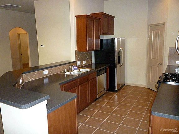 Nice size kitchen with under counter lighting, plenty of cou