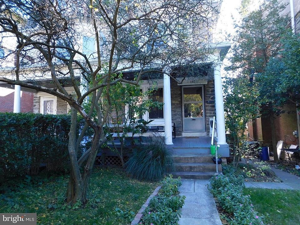 Front yard with lemon tree and covered front porch