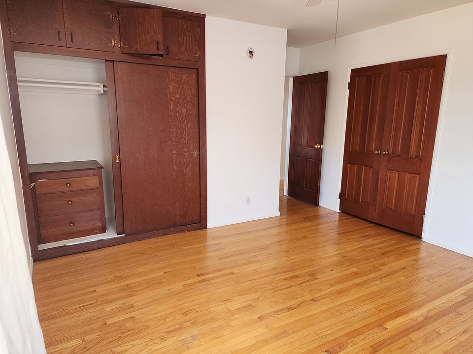 Main bedroom with double closets and storage.