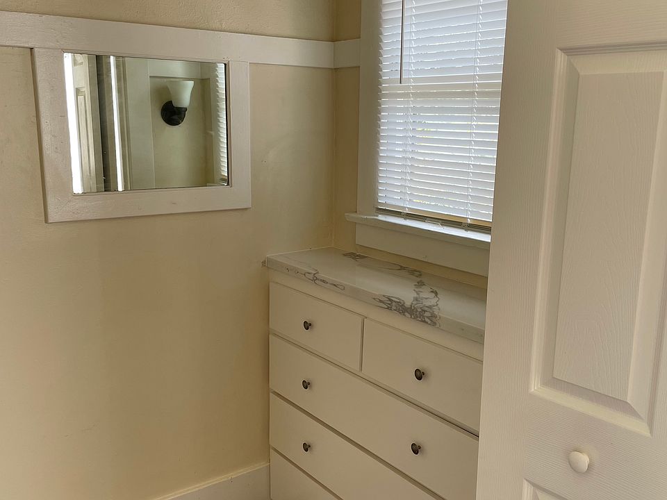 Walk-in closet with built in dresser.