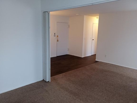 View of entry and dining area with new vinyl flooring