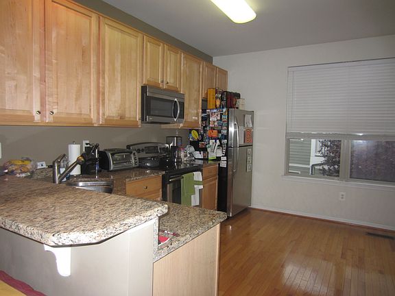 Eat-in kitchen with granite counter tops and stainless steel