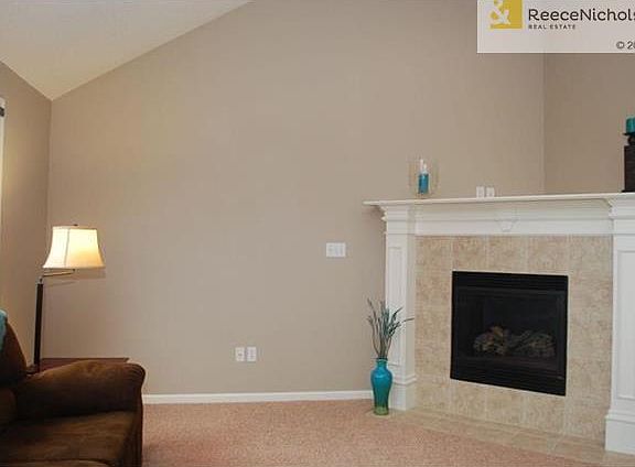Another view of the living room reveals the fireplace.