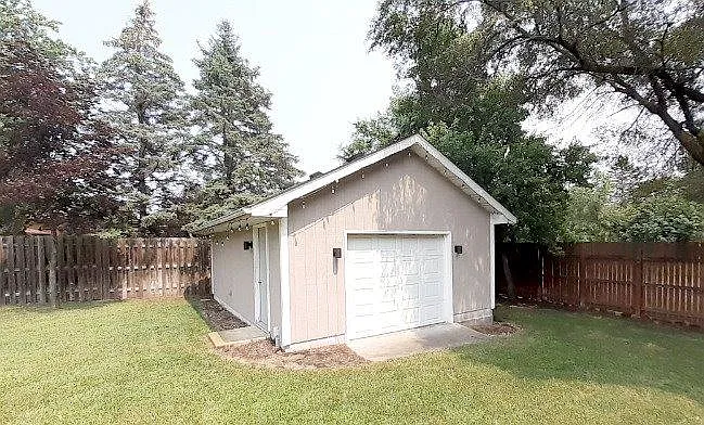 Shed/garage in back yard area